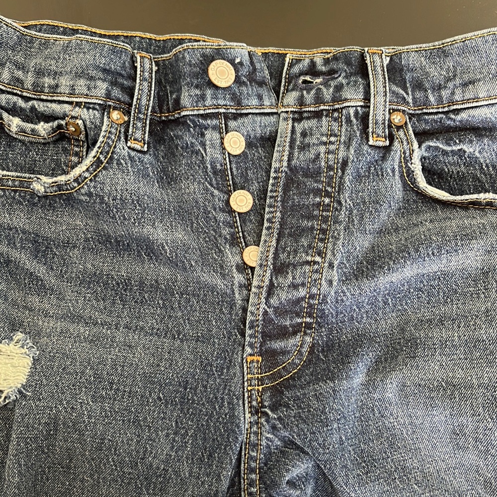 Gap denim in a distressed medium wash. Size 6/28 cheeky straight